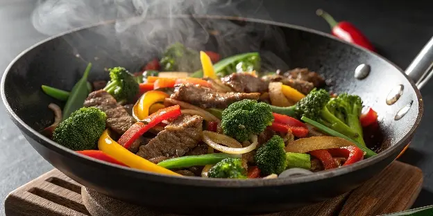 Beef stir-fry with vegetables in a wok.